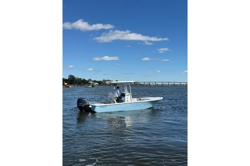 Slide: The Image of 2020 Tidewater 2300 Carolina Bay boat on calm water under blue sky. - 5