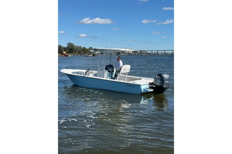 Slide: The Image of 2020 Tidewater 2300 Carolina Bay boat on water, rear view with Yamaha engine. - 6