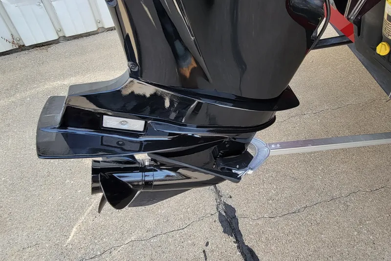 Slide: The Image of 2022 Bass Tracker Pro Team 175 XTE outboard motor on pavement. - 10