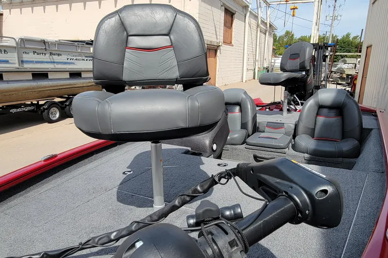 Slide: The Image of 2022 Bass Tracker Pro Team 175 XTE boat interior with gray seating and trolling motor. - 15