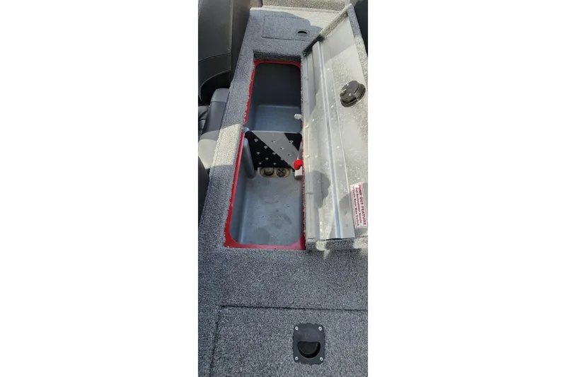 Slide: The Image of Open storage compartment in 2022 Bass Tracker Pro Team 175 XTE boat. - 18