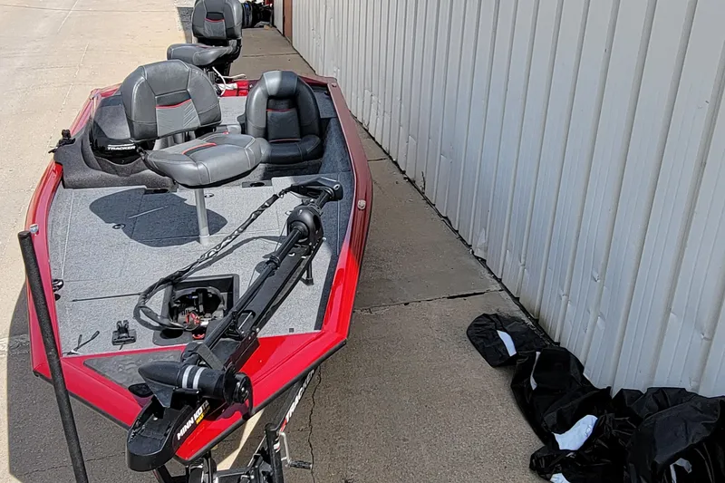 Slide: The Image of 2022 Bass Tracker Pro Team 175 XTE boat with red trim and seating. - 4