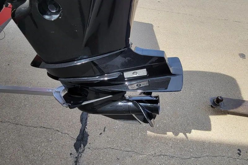 Slide: The Image of 2022 Bass Tracker Pro Team 175 XTE outboard motor on concrete surface. - 9