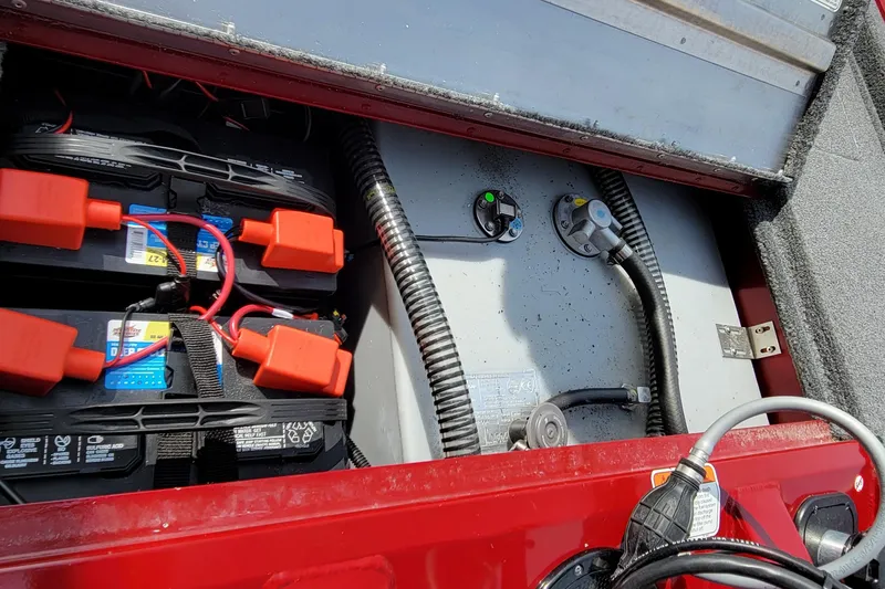 Slide: The Image of Battery compartment of 2022 Bass Tracker Pro Team 175 XTE boat, showing wiring and connections. - 20