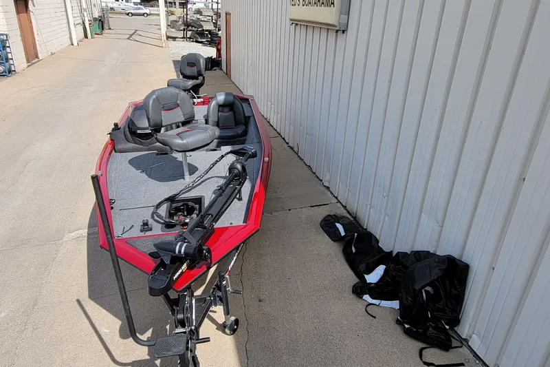 Slide: The Image of 2022 Bass Tracker Pro Team 175 XTE boat parked beside a building. - 5