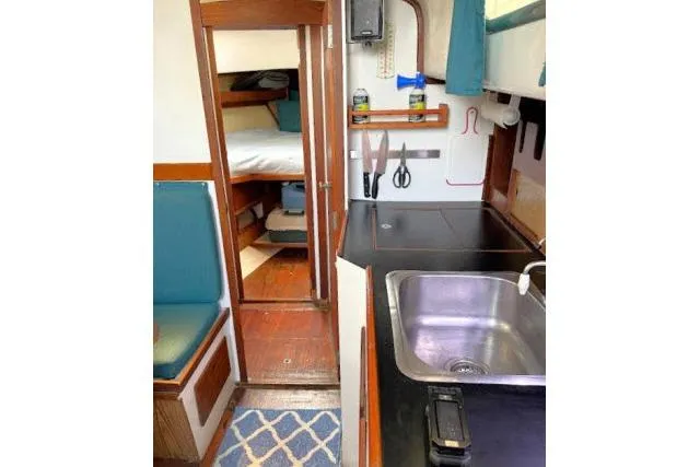 Slide: The Image of Interior of 1965 Pearson Alberg 35 sailboat with kitchenette and cozy cabin. - 10