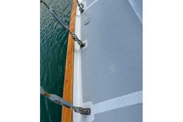 Slide: The Image of 1965 Pearson Alberg 35 sailboat deck with wooden trim and metal rigging. - 25