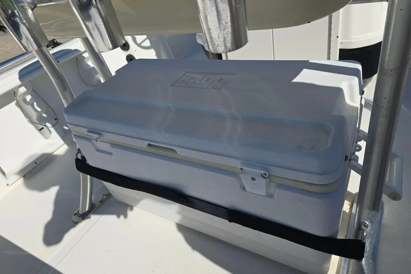 Slide: The Image of White Igloo cooler secured on a 2017 NauticStar 215 XTS boat deck. - 16