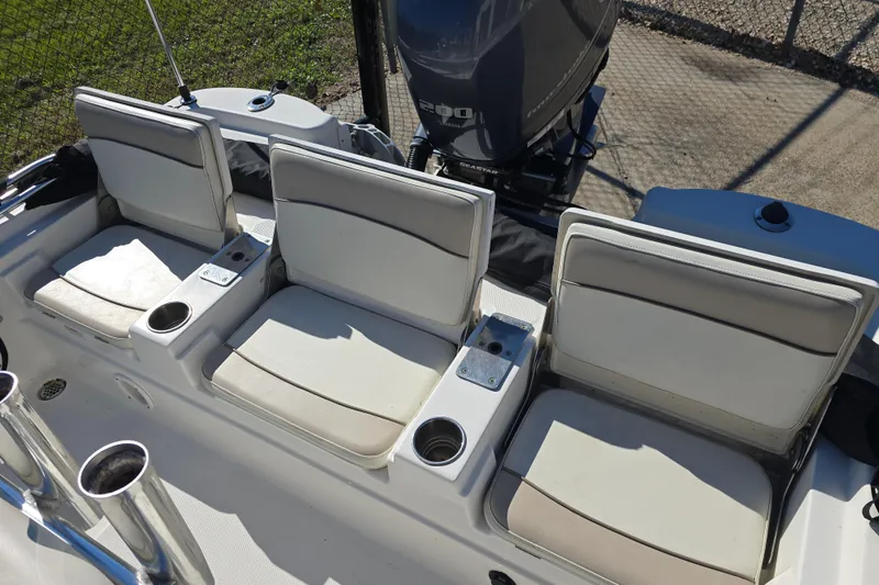 Slide: The Image of 2017 NauticStar 215 XTS boat seats with cup holders and Yamaha engine. - 17