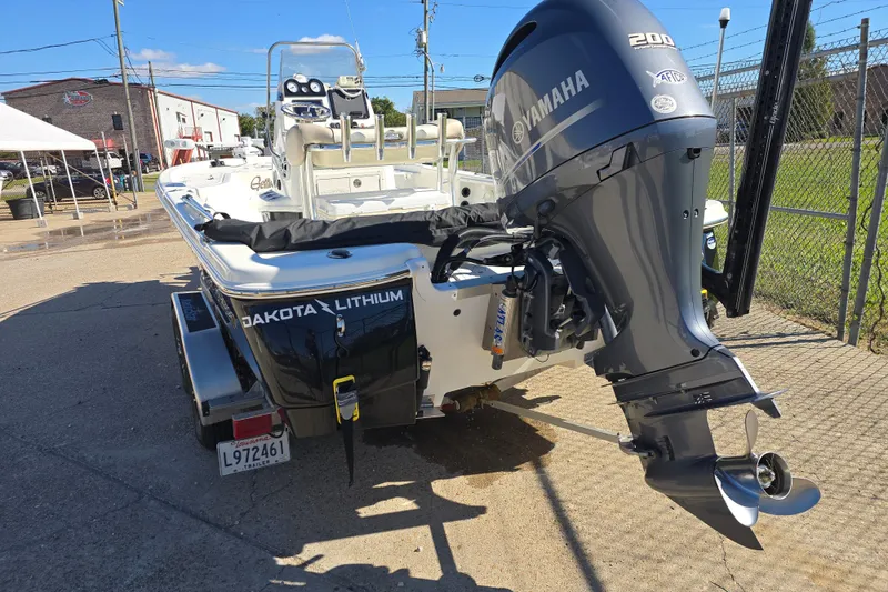 Slide: The Image of 2017 NauticStar 215 XTS boat with Yamaha engine, parked on a trailer. - 3