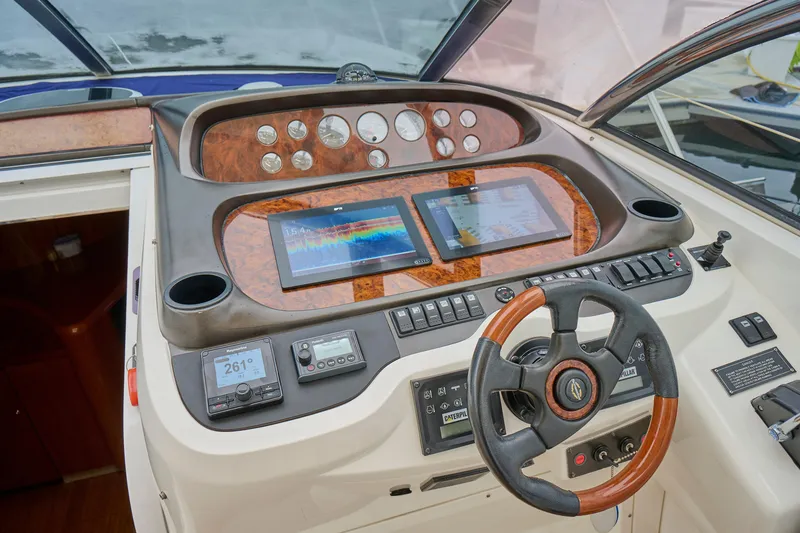 Slide: The Image of Cockpit of 2000 Sunseeker Camargue 50 yacht with modern navigation instruments. - 11