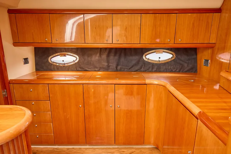 Slide: The Image of Luxurious wooden interior of 2000 Sunseeker Camargue 50 yacht kitchen. - 12