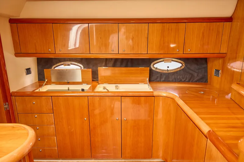 Slide: The Image of Luxurious wooden interior of 2000 Sunseeker Camargue 50 yacht kitchen. - 13