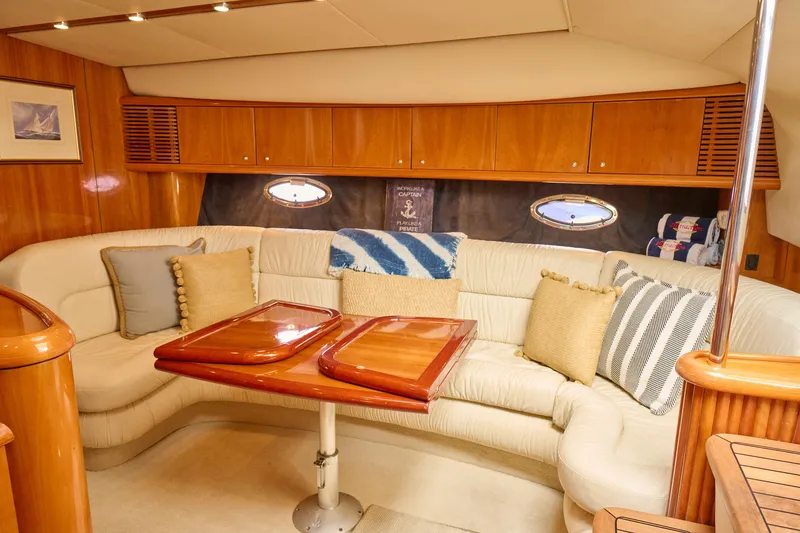 Slide: The Image of Luxurious interior of 2000 Sunseeker Camargue 50 yacht with plush seating and wooden accents. - 20