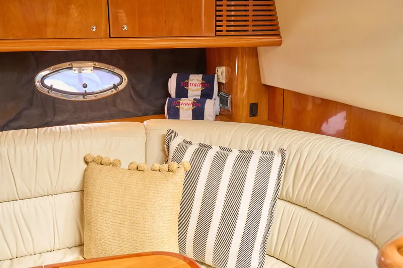 Slide: The Image of Luxurious interior of 2000 Sunseeker Camargue 50 yacht with plush seating and decorative pillows. - 23