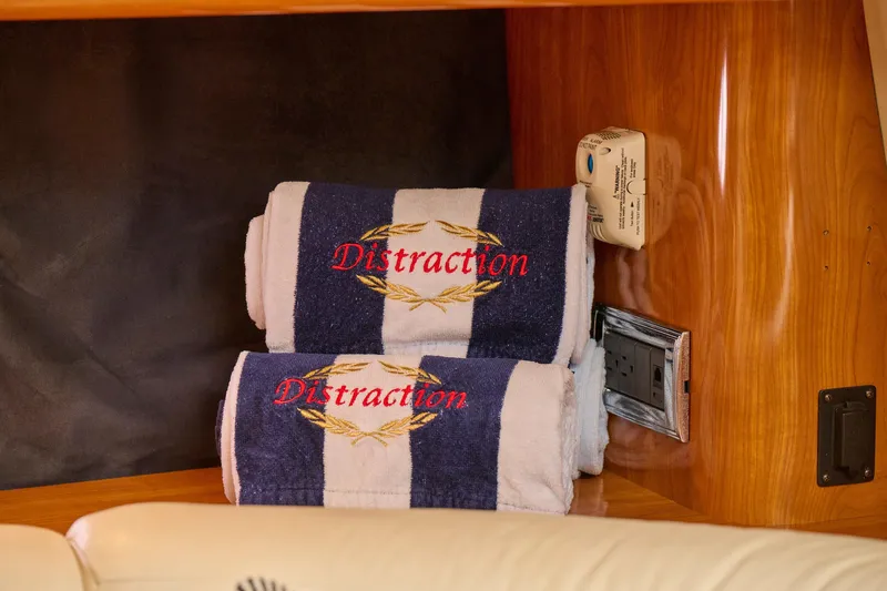 Slide: The Image of Embroidered towels on Sunseeker Camargue 50 yacht, 2000 model, with wood paneling. - 24