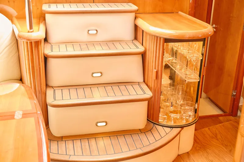 Slide: The Image of Luxurious interior of 2000 Sunseeker Camargue 50 yacht with elegant wooden stairs and glass cabinet. - 25
