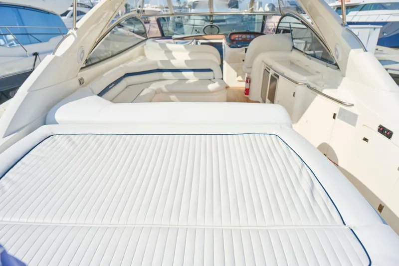 Slide: The Image of Luxurious Sunseeker Camargue 50 yacht interior, 2000 model, featuring elegant white seating. - 42