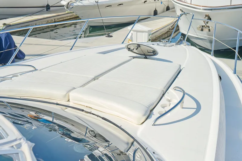 Slide: The Image of Sunseeker Camargue 50 yacht, 2000 model, featuring a spacious sun deck at the marina. - 44