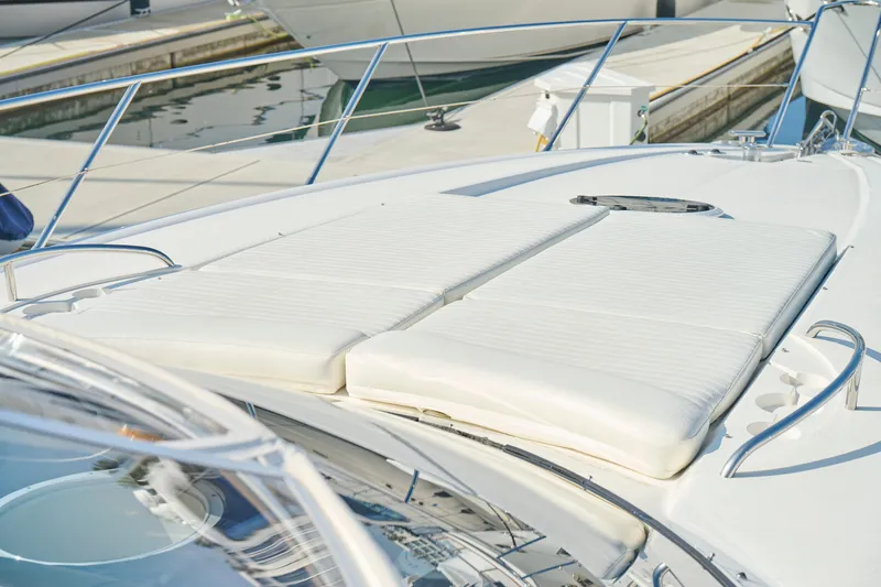 Slide: The Image of Sunseeker Camargue 50 yacht deck with white sunbathing cushions, 2000 model. - 48