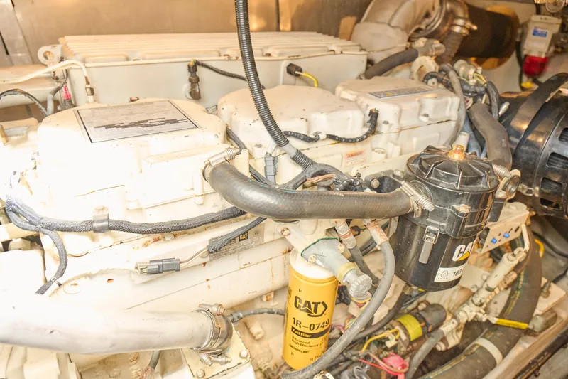 Slide: The Image of Engine compartment of a 2000 Sunseeker Camargue 50 yacht, featuring CAT components. - 59