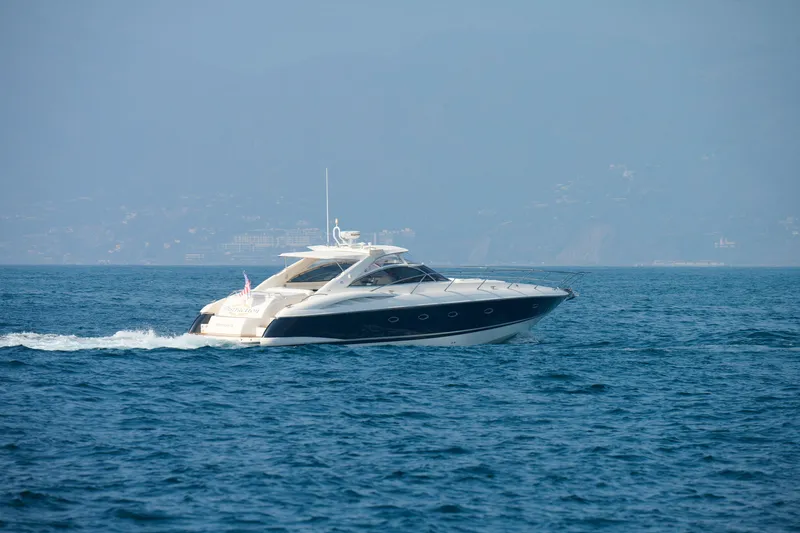 Slide: The Image of 2000 Sunseeker Camargue 50 yacht cruising on open water. - 63