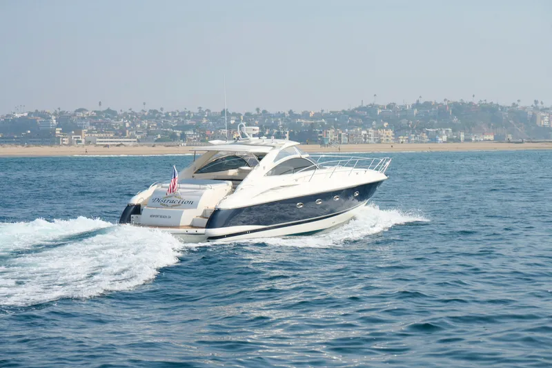 Slide: The Image of Sunseeker Camargue 50 yacht cruising near coastline, 2000 model. - 65