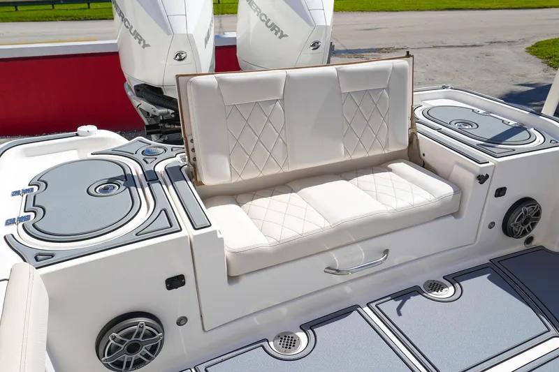 Slide: The Image of 2021 Blue Wave Boats Makaira with cushioned seating and dual Mercury engines. - 6