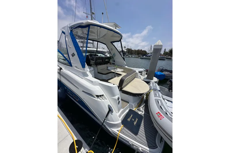 Slide: The Image of 2020 Monterey 355 Sport Yacht docked at marina, featuring spacious seating and sleek design. - 15