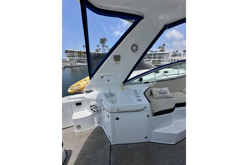 Slide: The Image of 2020 Monterey 355 Sport Yacht interior with seating and marina view. - 21