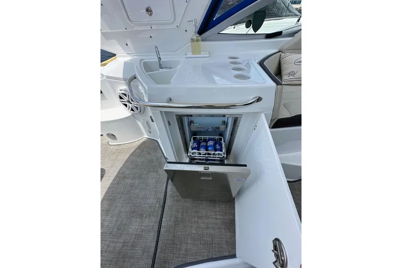 Slide: The Image of Monterey 355 Sport Yacht 2020 with open mini fridge and sink area. - 22