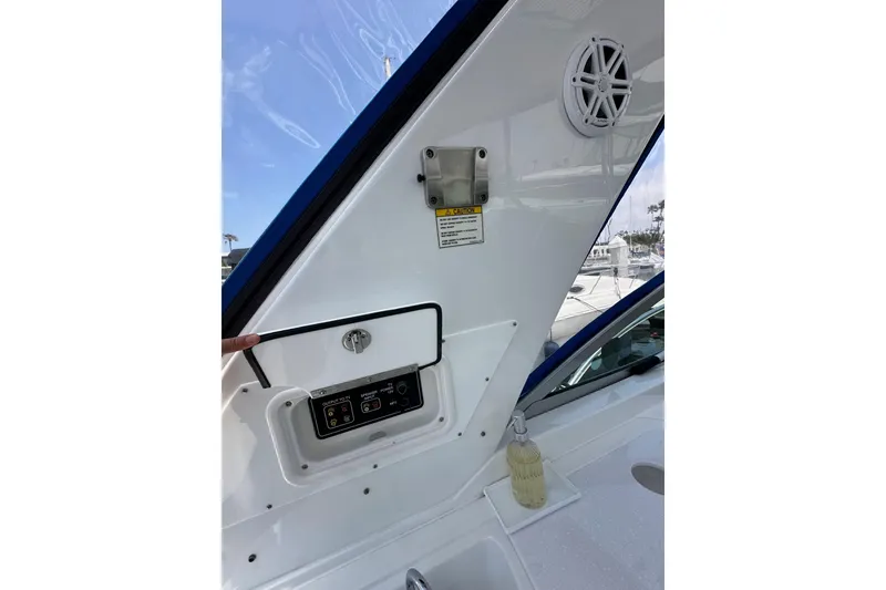 Slide: The Image of Interior view of a 2020 Monterey 355 Sport Yacht, featuring control panel and speaker. - 23