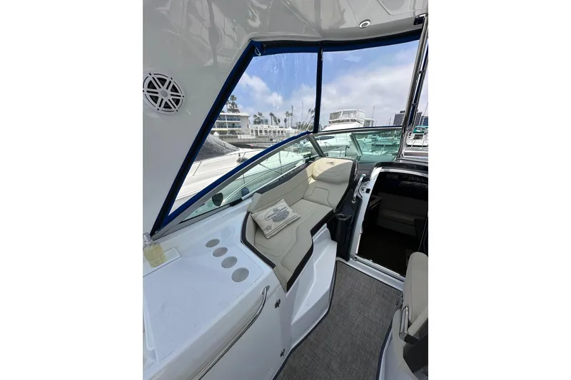 Slide: The Image of Interior view of 2020 Monterey 355 Sport Yacht with seating and marina backdrop. - 24
