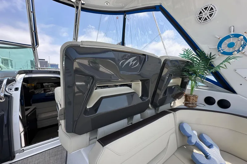 Slide: The Image of Interior of 2020 Monterey 355 Sport Yacht with plush seating and nautical decor. - 25