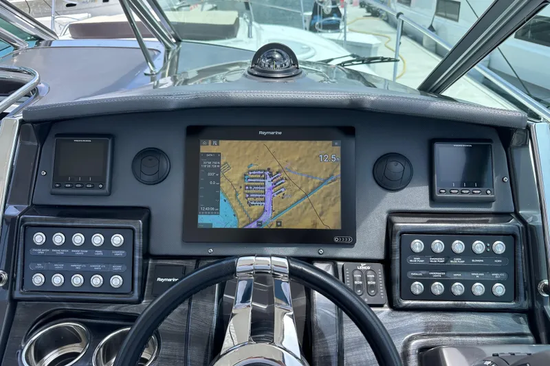 Slide: The Image of Dashboard of 2020 Monterey 355 Sport Yacht with navigation and control panels. - 29
