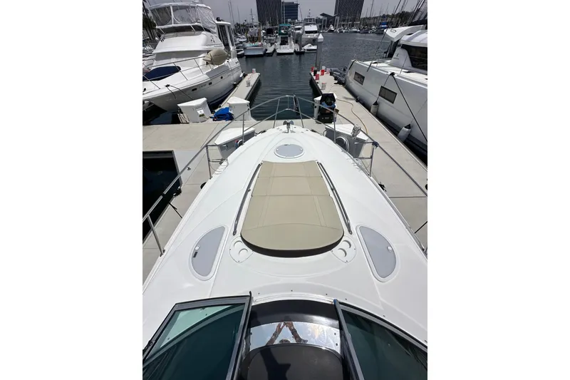 Slide: The Image of 2020 Monterey 355 Sport Yacht docked at marina, showcasing sleek design and spacious deck. - 32