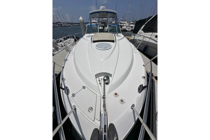 Slide: The Image of 2020 Monterey 355 Sport Yacht docked at marina, showcasing sleek design and spacious deck. - 33