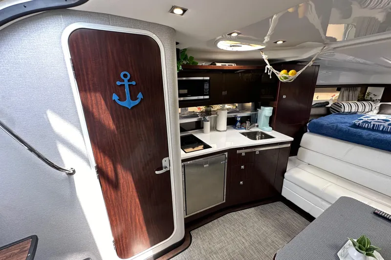 Slide: The Image of Interior of 2020 Monterey 355 Sport Yacht with kitchenette and cozy seating area. - 39