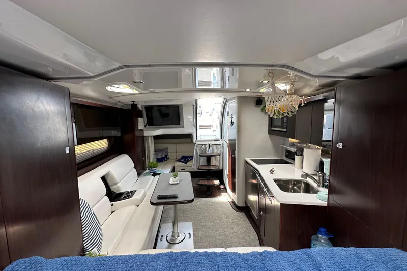 Slide: The Image of Interior of 2020 Monterey 355 Sport Yacht, featuring modern kitchen and cozy seating area. - 46