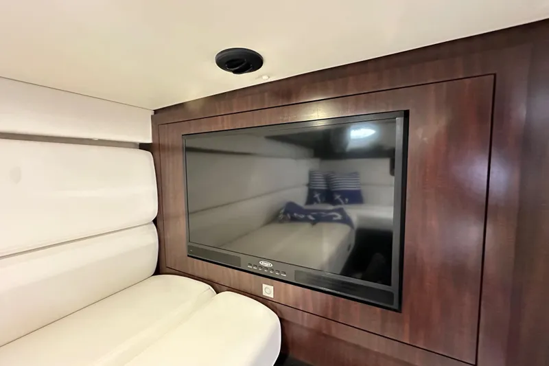Slide: The Image of Interior of 2020 Monterey 355 Sport Yacht with TV and white seating. - 54