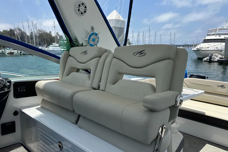 Slide: The Image of Luxury seating on a 2020 Monterey 355 Sport Yacht, docked at a marina. - 60