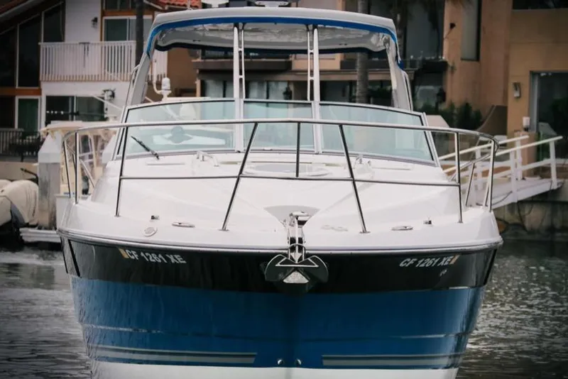 Slide: The Image of 2020 Monterey 355 Sport Yacht docked in a marina, front view. - 62