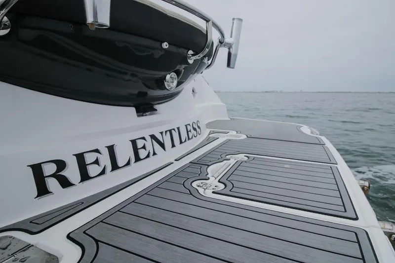 Slide: The Image of 2020 Monterey 355 Sport Yacht on water, featuring "Relentless" name on deck. - 63