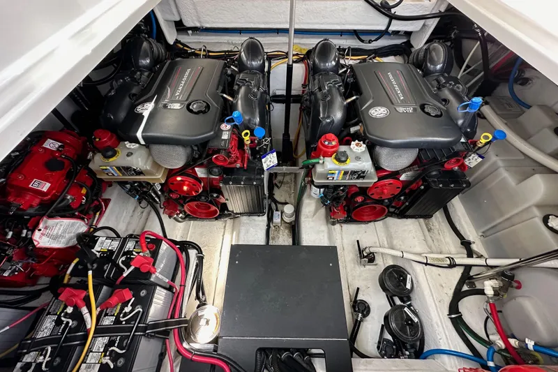 Slide: The Image of Engine compartment of a 2020 Monterey 355 Sport Yacht, showcasing dual engines and wiring. - 70