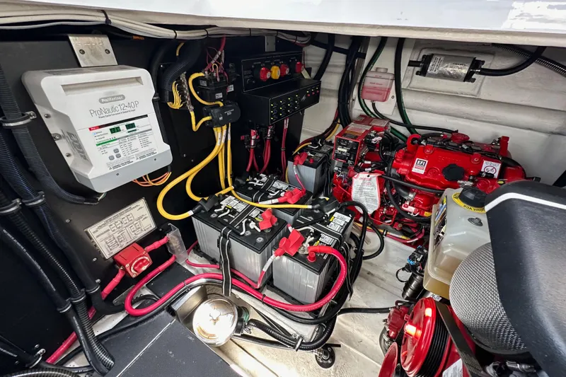 Slide: The Image of Engine compartment of 2020 Monterey 355 Sport Yacht with batteries and wiring. - 74