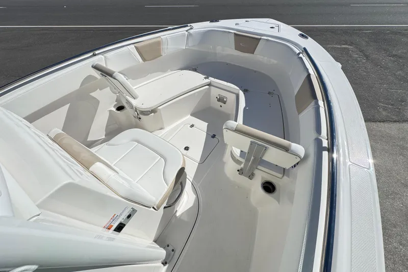 Slide: The Image of 2026 Robalo R230 Center Console boat interior with seating and storage. - 11