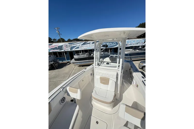 Slide: The Image of 2026 Robalo R230 Center Console boat with sleek design and spacious seating. - 17