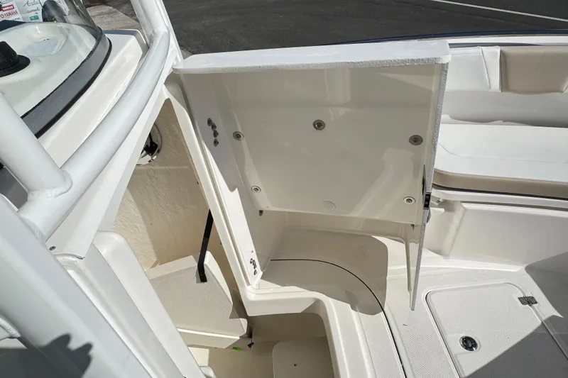 Slide: The Image of 2026 Robalo R230 Center Console boat interior storage compartment. - 18