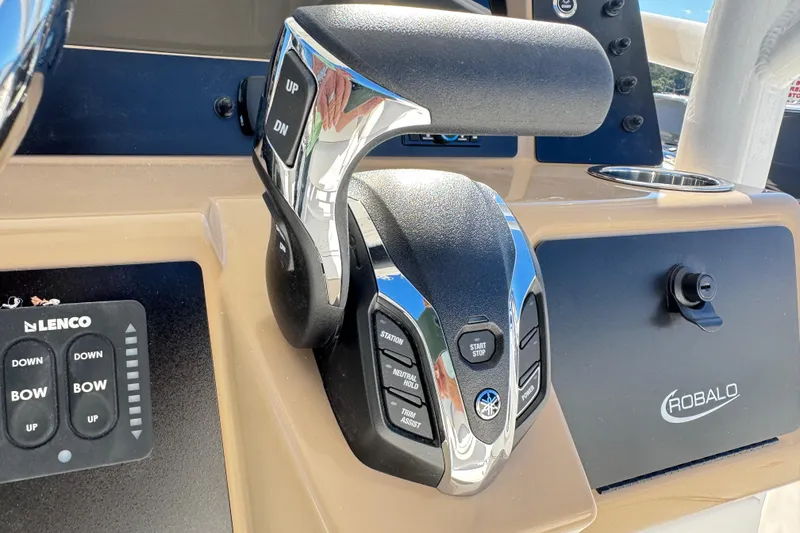 Slide: The Image of 2026 Robalo R230 Center Console boat controls with Yamaha throttle and Lenco trim tabs. - 21