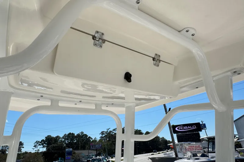 Slide: The Image of 2026 Robalo R230 Center Console boat with overhead storage compartment. - 24